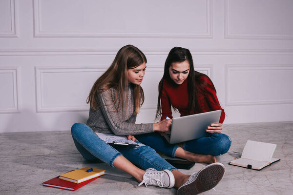 Young Female Students Checking Data Laptop Taking Notes Paper While Stock Image