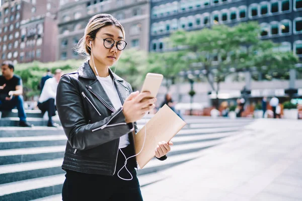 Chinese Hipster Girl Optical Spectacles Electronic Headphones Choosing Music Download — Stock Photo, Image