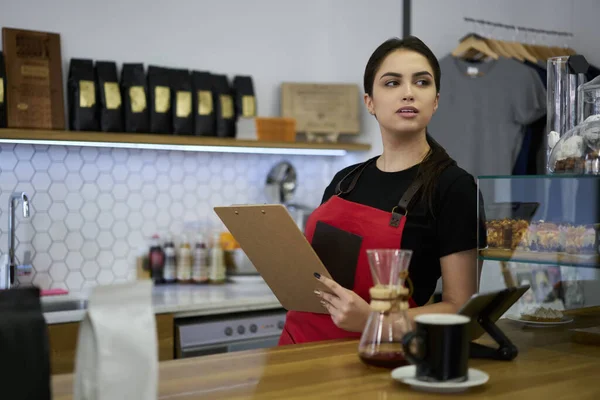 Skilled Brunette Female Waitress Standing Bar Planner Making Finance Report — Stockfoto