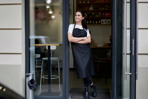 Cheerful Brunette Caucasian Owner Coffee Shop Apron Standing Entrance Greeting — Foto Stock