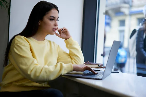 Pensive Caucasian Brunette Student Watching Online Webinar Study Course Using — ストック写真
