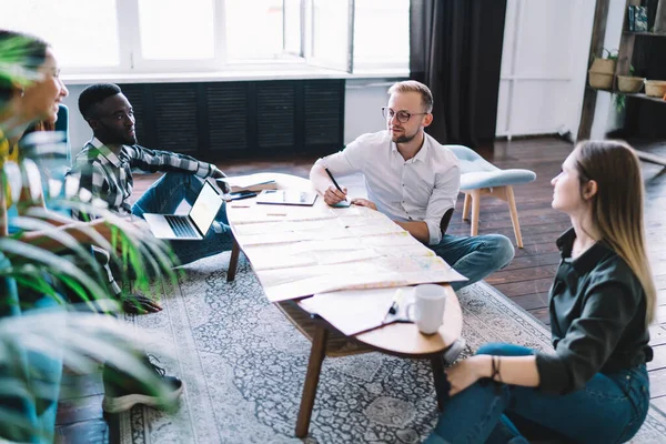 Group Multiethnic Friends Casual Wear Gathering Sitting Table Map Together — Fotografie, imagine de stoc