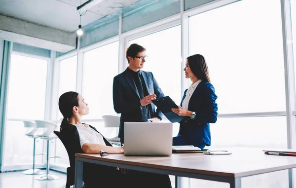 Competitive Caucasian Employers Discussing Paperwork Reports Collaborative Briefing Office Interior — Stok fotoğraf