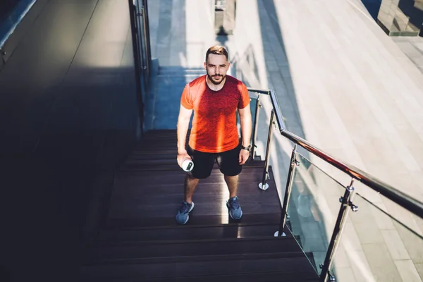 Full Body Young Bearded Male Standing Stairs Bottle Hand Looking — Stockfoto