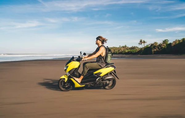 Side View Full Length Male Biker Driving Electric Scooter Sandy — Zdjęcie stockowe