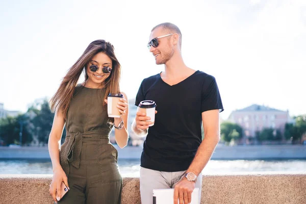 Joyful Couple Casual Clothes Cups Coffee Standing Promenade Background Bright — Fotografia de Stock