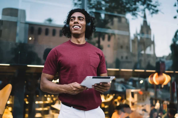 stock-photo-happy-millennial-man-touch-pad