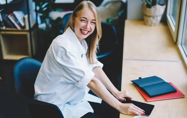 Laughing Young Woman White Shirt Rolled Sleeves Sitting Table Tablet — 图库照片