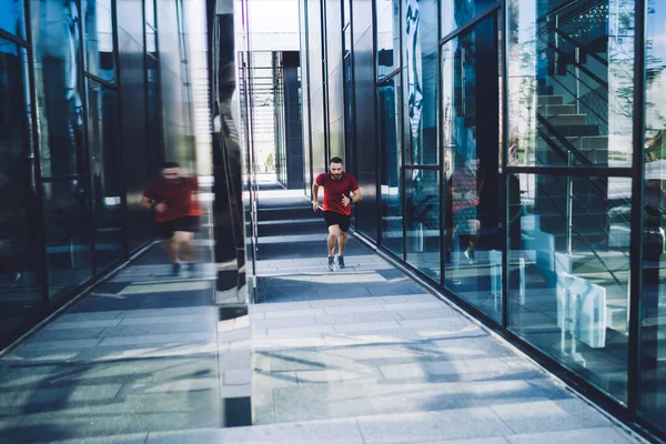 Full Length Young Athlete Male Sportswear Jogging Glass Windows Modern — Foto de Stock