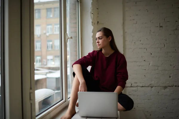 Young Concentrated Female Freelancer Casual Outfit Long Hair Looking Away — Foto Stock