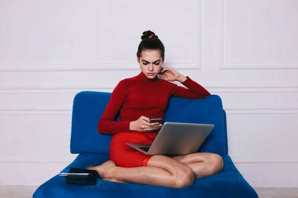 Young Focused Female Red Clothes Surfing Internet Mobile Phone Sitting — Foto Stock