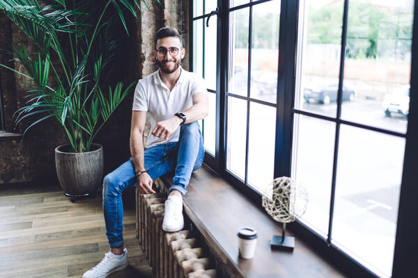  Happy Turkish male model dressed in casual clothing outfit smiling at camera posing in loft interior