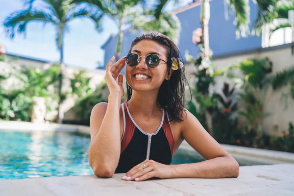 Satisfied Female Toothy Smile Sunglasses Sporty Swimsuit Enjoying Summer Vacation — стоковое фото