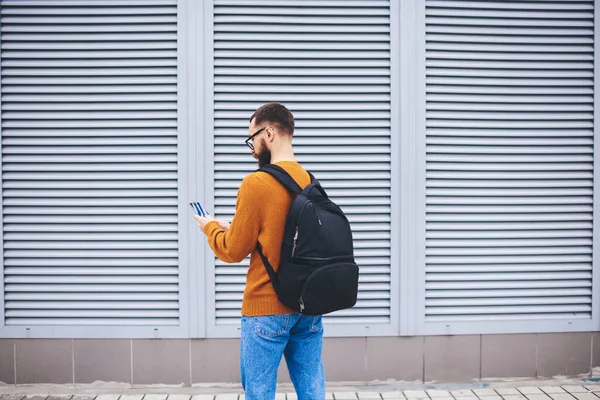 Back View Slender Young Bearded Hipster Black Backpack Checking Notifications — Stock Photo, Image