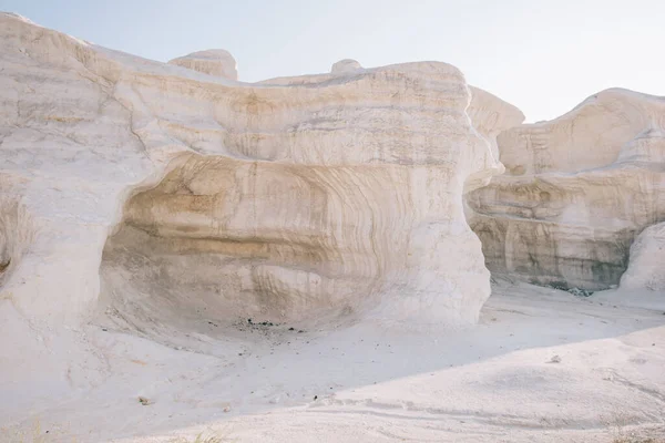 From height of picturesque scenery of rocky desert terrain with big mountains on white scorched sandy land in Kazakhstan Ustyurt Nature Reserve