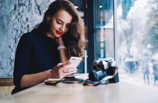 Smiling Female Photographer Red Lips Browsing Mobile Looking Screen While — Stock Photo, Image