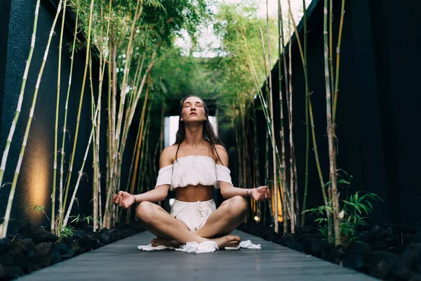 Low Angle Tranquil Female Trendy Clothes Sitting Wooden Pathway Padmasana — Stock Photo, Image