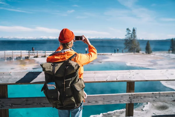 Female Traveler Orange Beanie Hat Big Backpack Standing Fence Taking — Stockfoto
