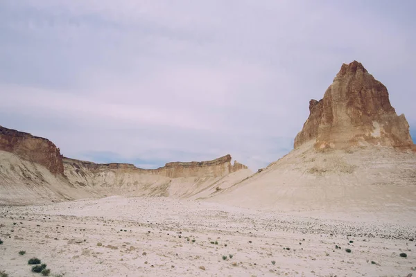 Spectacular View Rocky Formations Situated Cloudy Sky Waterless Desert Valley — Stockfoto