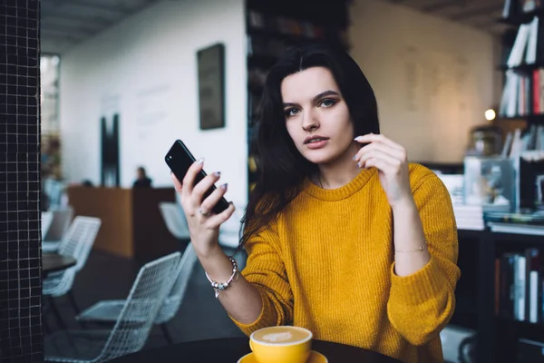 Serious Young Woman Long Hair Bright Sweater Sitting Cup Coffee — Stock Photo, Image