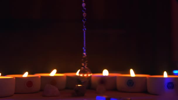 Mystic esoteric forune telling with spinning crystal quartz pendulum. — Stock video