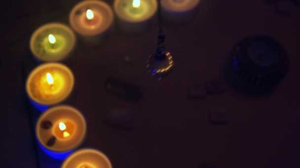 Fate Forecasting Candles Rose Quartz Pendulum Smoky Background — Stock Video