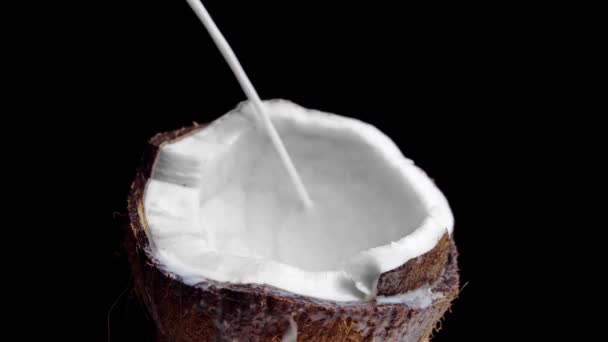 Pouring Milk Half Coconut Close Front View — Videoclip de stoc