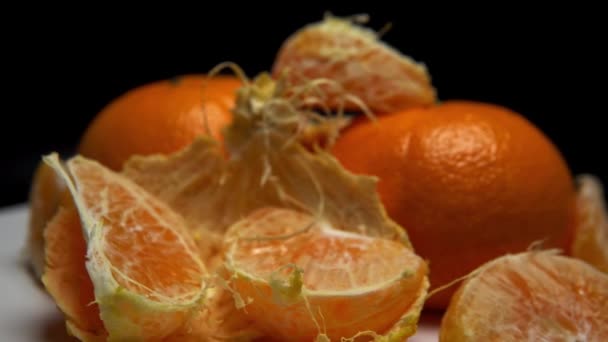 Fresh Ripe Peeled Tangerines White Surface Rotation — Stockvideo