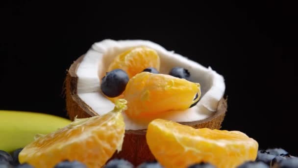 Platter Orange Slices Berries Banana Half Coconut Rotation — Video