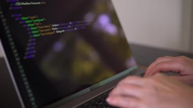 Person is learning to program. Footage with hands and laptop close up