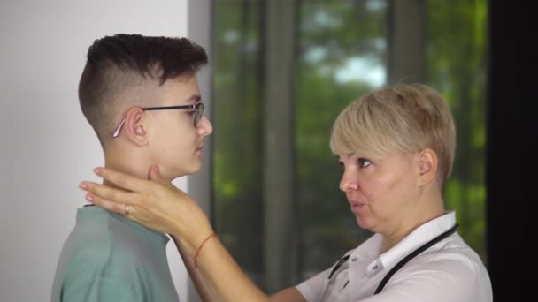 Young Boy Patient Glasses Clinic Appointment Adult Woman Doctor Checking — Video Stock