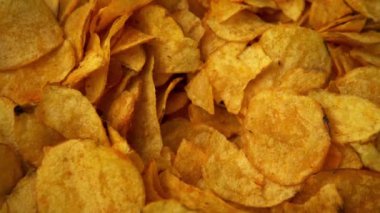 Potato chips rotating close up. Fast food snacks. High quality 4k footage