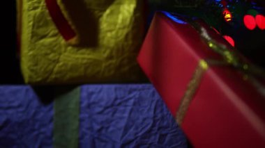 The pile of presents in corrugated gift wrap for Christmas close up.