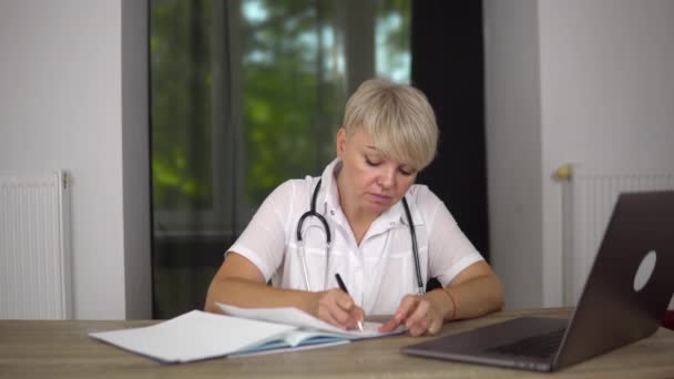 Tired Adult Woman Doctor Typing Documents Illness Patient Notebook Work — Wideo stockowe
