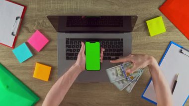 Guy is sharing the app where people can earn easy money on freelance green screen mockup. Waving 100 dollar bills. American value.