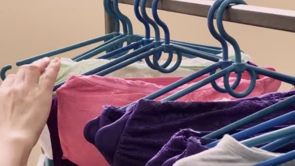 Girl Chooses Underwear Store Clothes Plastic Hangers High Quality Footage — Video