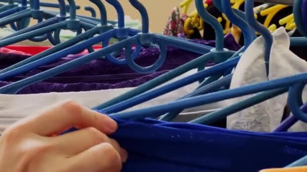 Girl Chooses Underwear Store Clothes Plastic Hangers High Quality Footage — Wideo stockowe