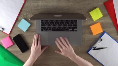 Man is creating design for the websites using laptop. Graphic design. Work from home.