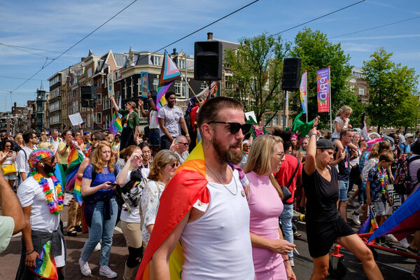 AMSTERDAM - JULY 30: Pride Amsterdam 2022 kicks off with Pride Walk on July 30, 2022 in Amsterdam, The Netherlands. This annual event is meant to celebrate freedom and diversity.