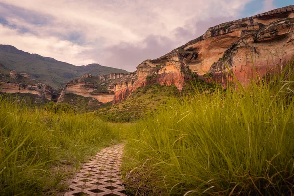 A path leading to Mushroom Rock in the Golden Gate Highlands National Park. This nature reserve is part of the Maluti Mountains belonging to the Drakensberg range in South Africa.