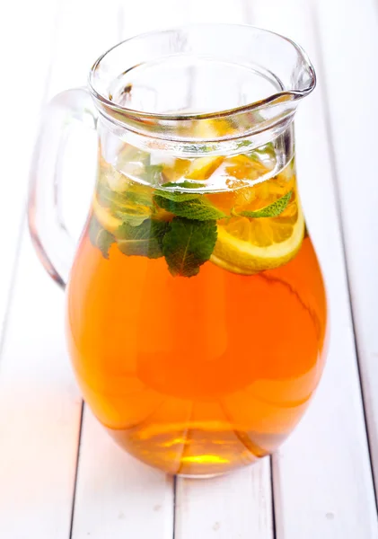 Ice tea with mint and lemon in a jar — Stock Photo, Image