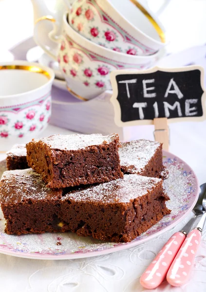 Chocolate brownies dusted with icing sugar