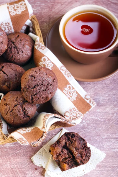 Chocolate muffins and cup of tea — Stock Photo, Image