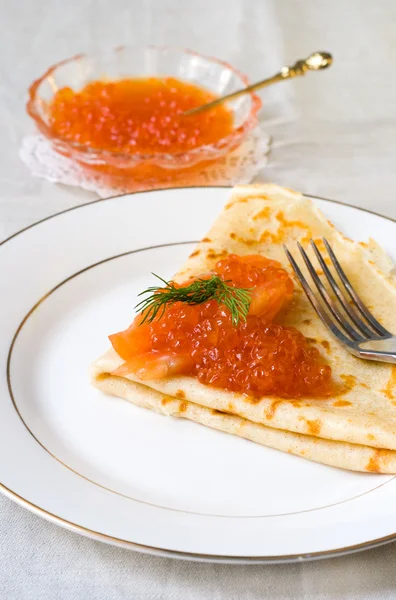 Rye thin pancake with red caviar, salmon — Stock Photo, Image