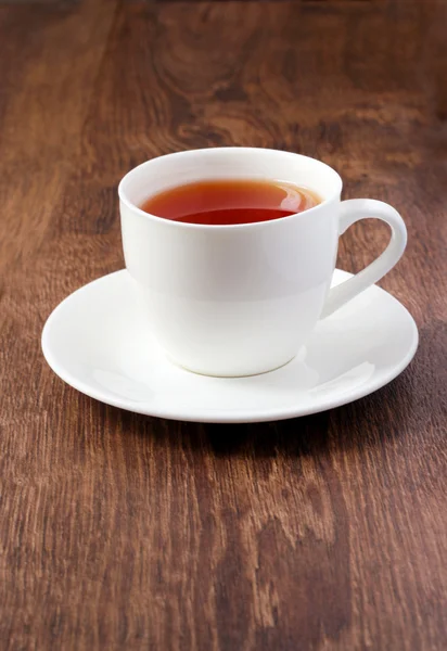 Cup of tea on wood surface — Stock Photo, Image