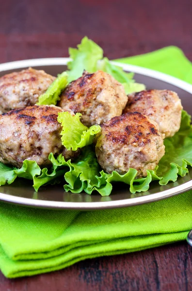 Meatballs on salad leaves — Stock Photo, Image