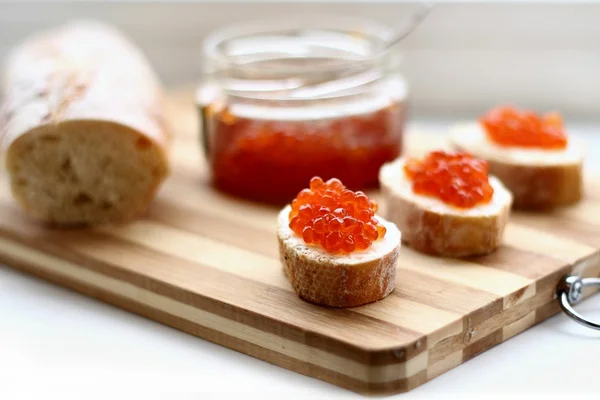 Red caviar in spoon — Stock Photo, Image