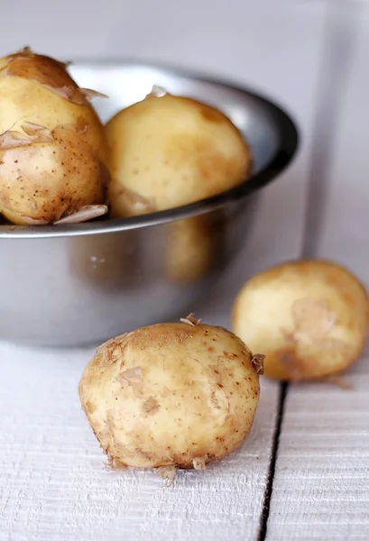 Potatoes in a metal bowl — Stock Photo, Image