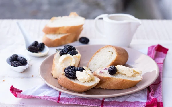 French breakfast in the garden, snack on baguette — Stock Photo, Image