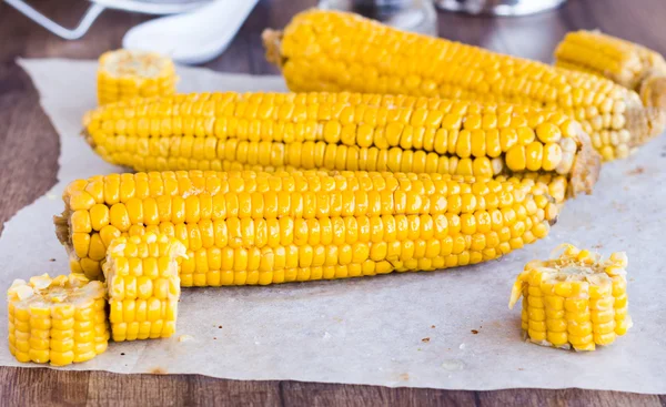 Hot yellow corn on the wooden background — Stock Photo, Image